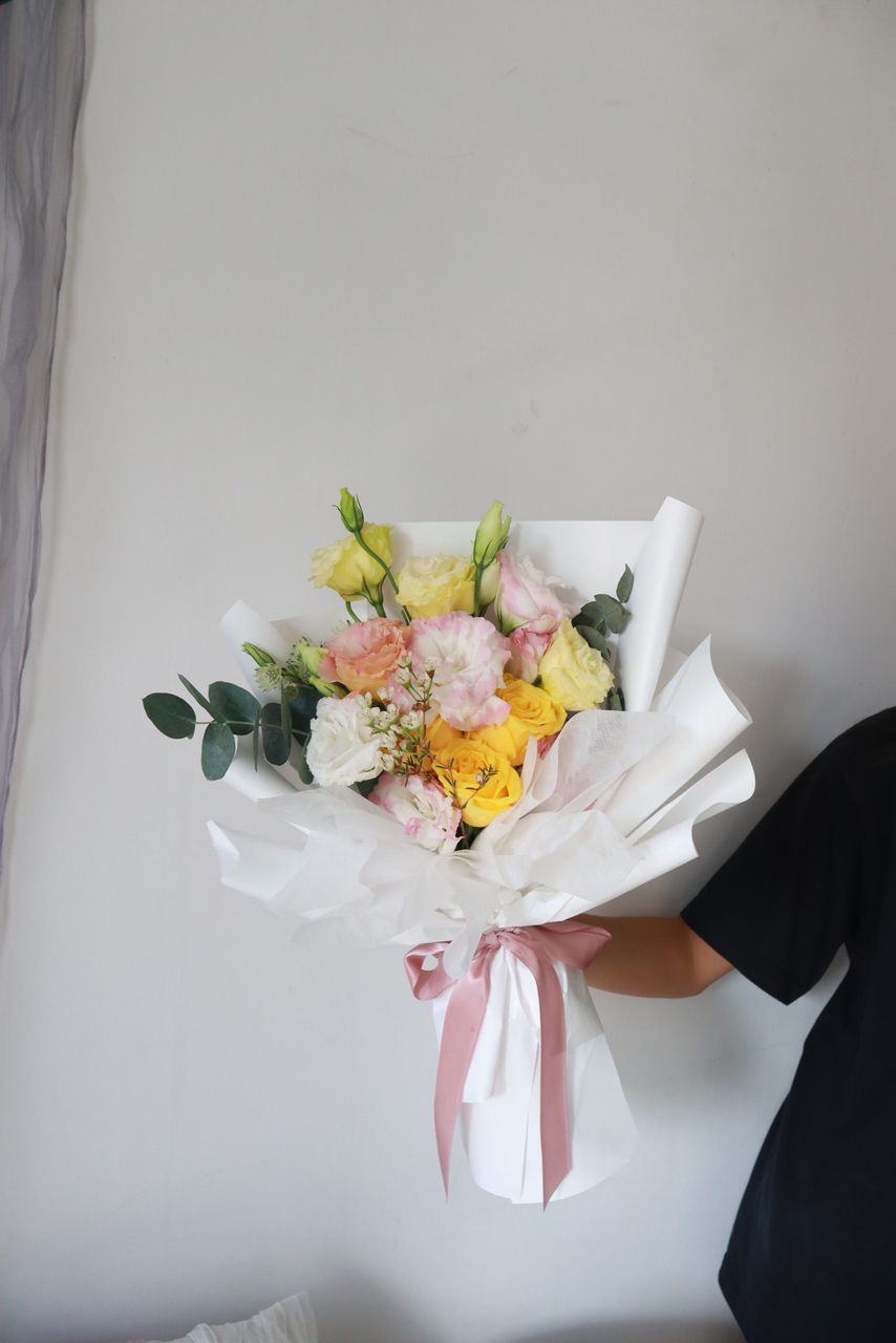 Yellow and pink bouquet with satin ribbon